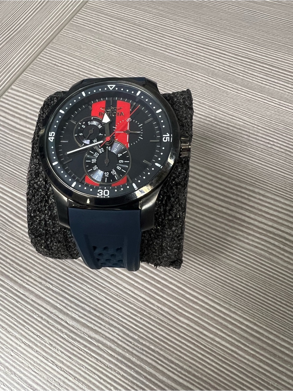 Invicta Black Case Men’s Chronograph Watch with Blue Strap and Red Dial Accents